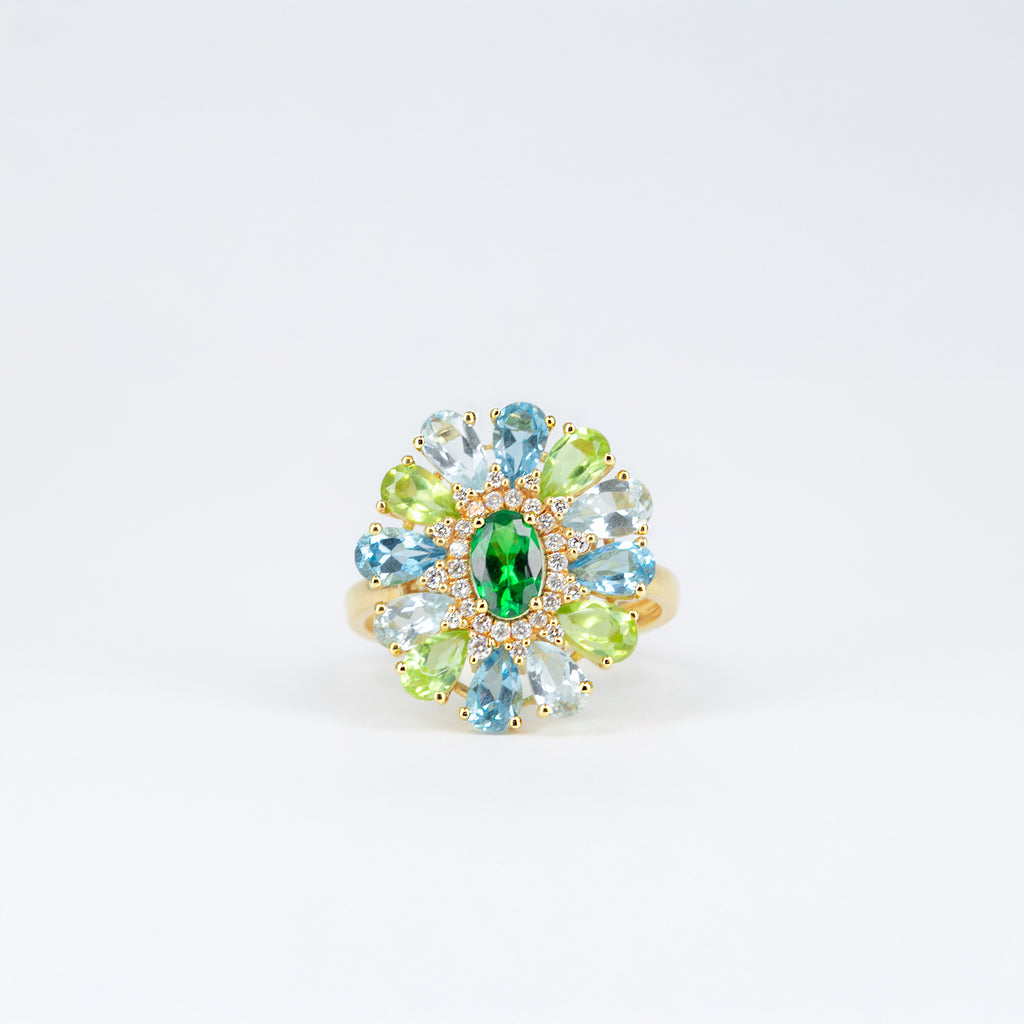 Bague tsavorite, péridots et topazes