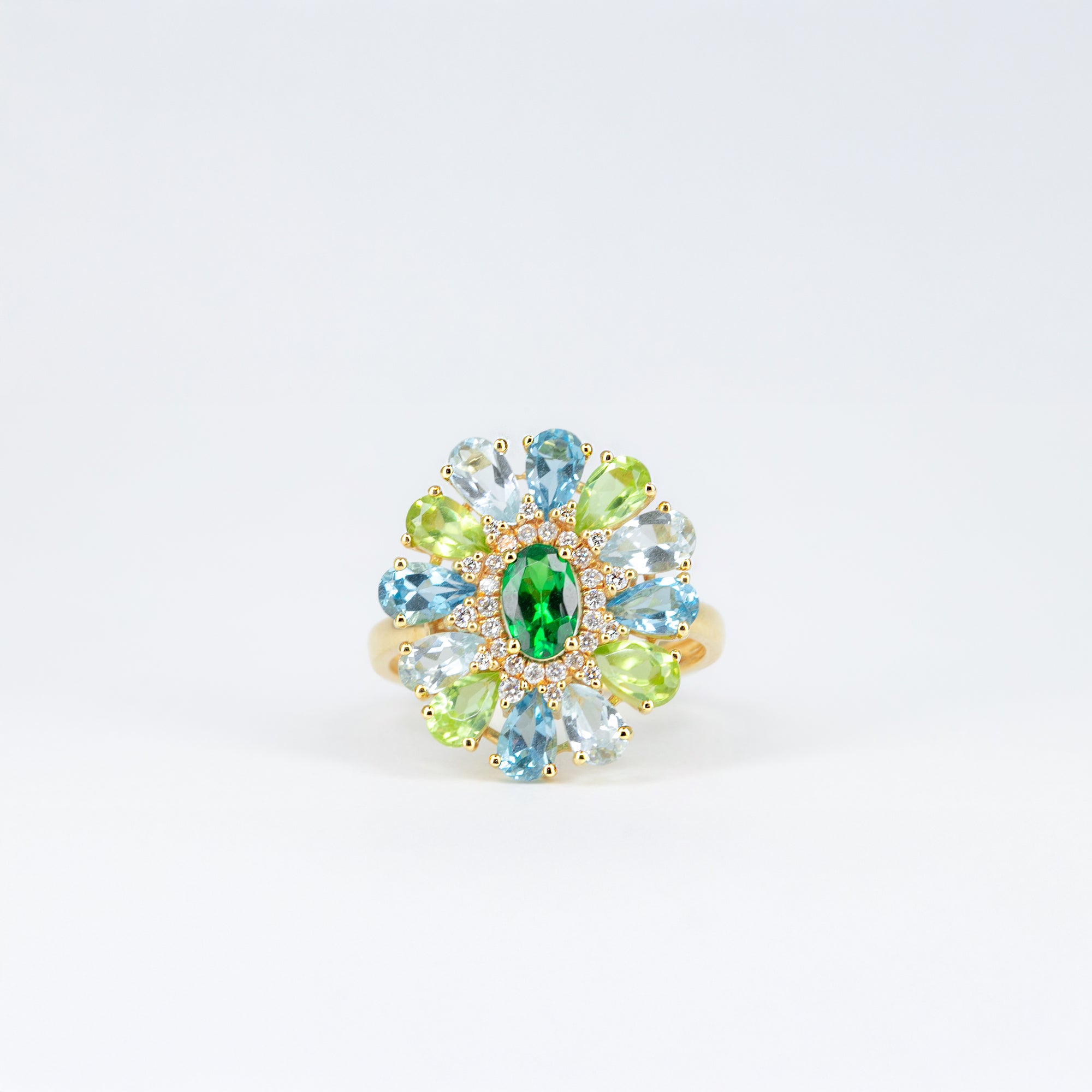 Bague tsavorite, péridots et topazes