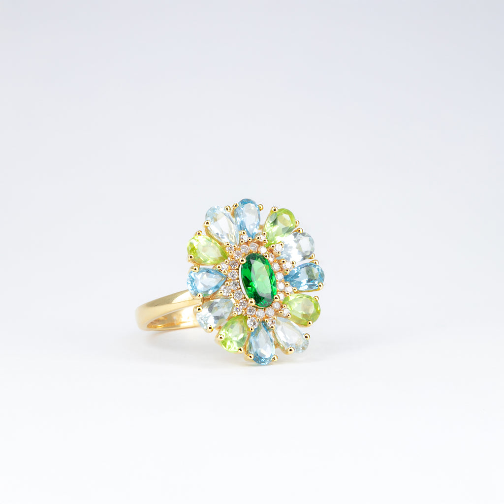 Bague tsavorite, péridots et topazes