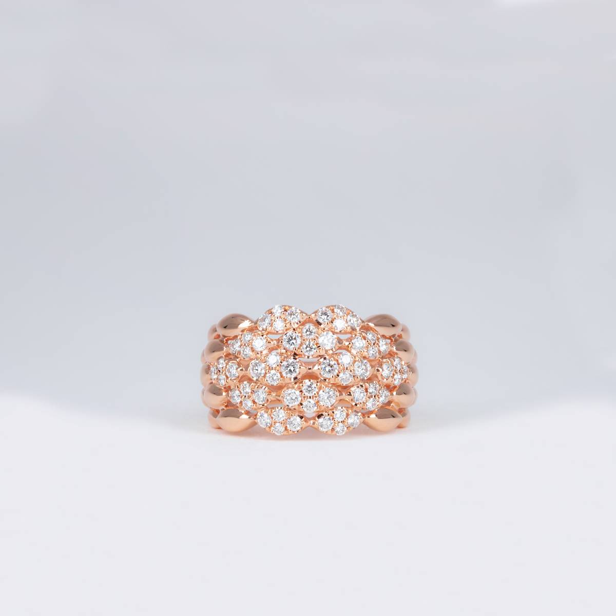 Bague or rose ondulés pavés de diamants
