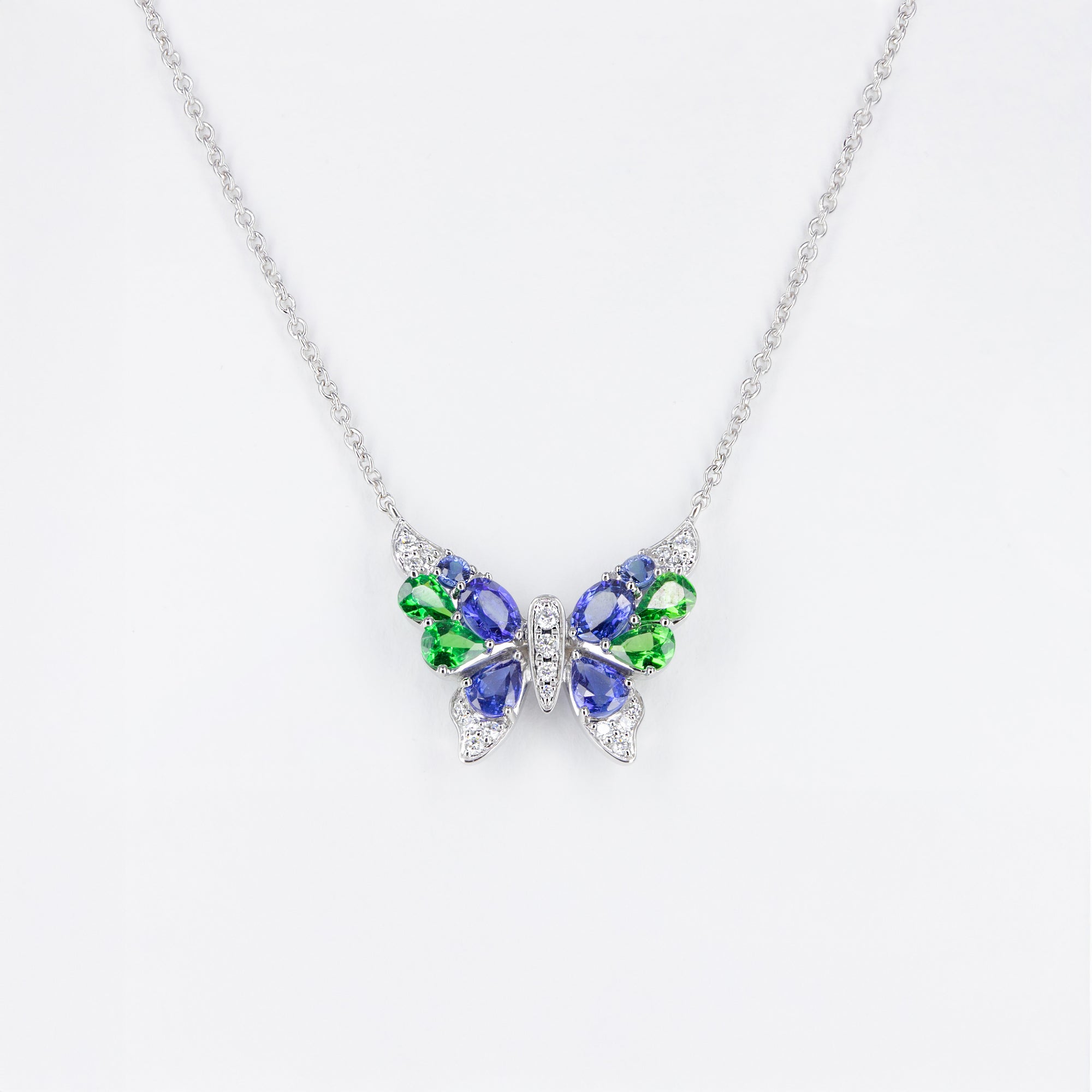 Pendentif Papillon tsavorites et saphirs bleus