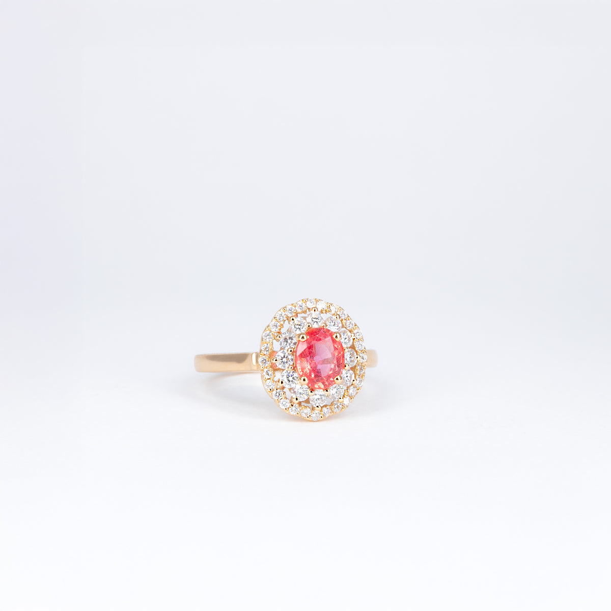 Bague en or rose 18K avec saphir orange padparadscha et double entourage de diamants